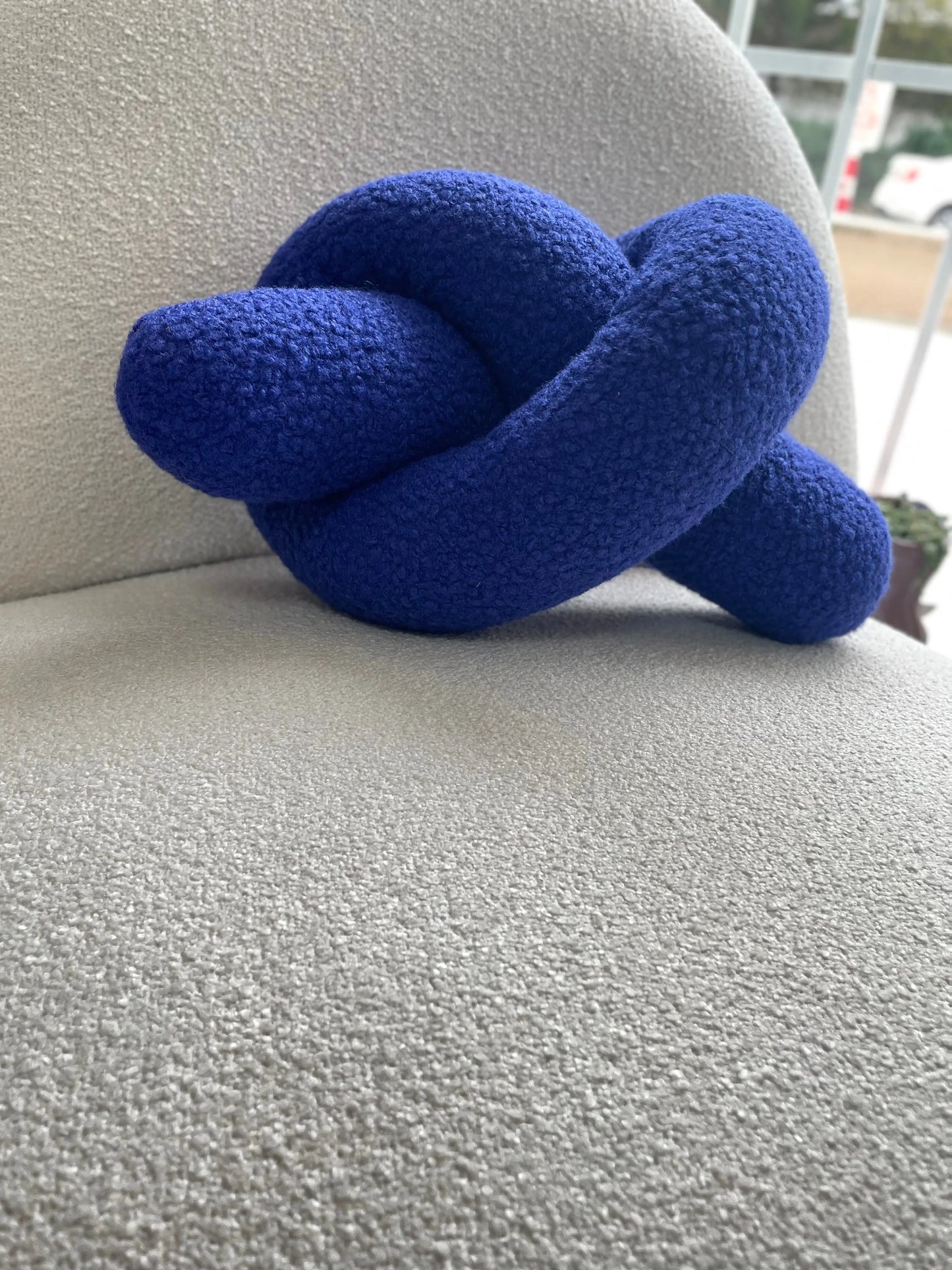 Blue Boucle Knot Pillow: Modern Accent Cushion