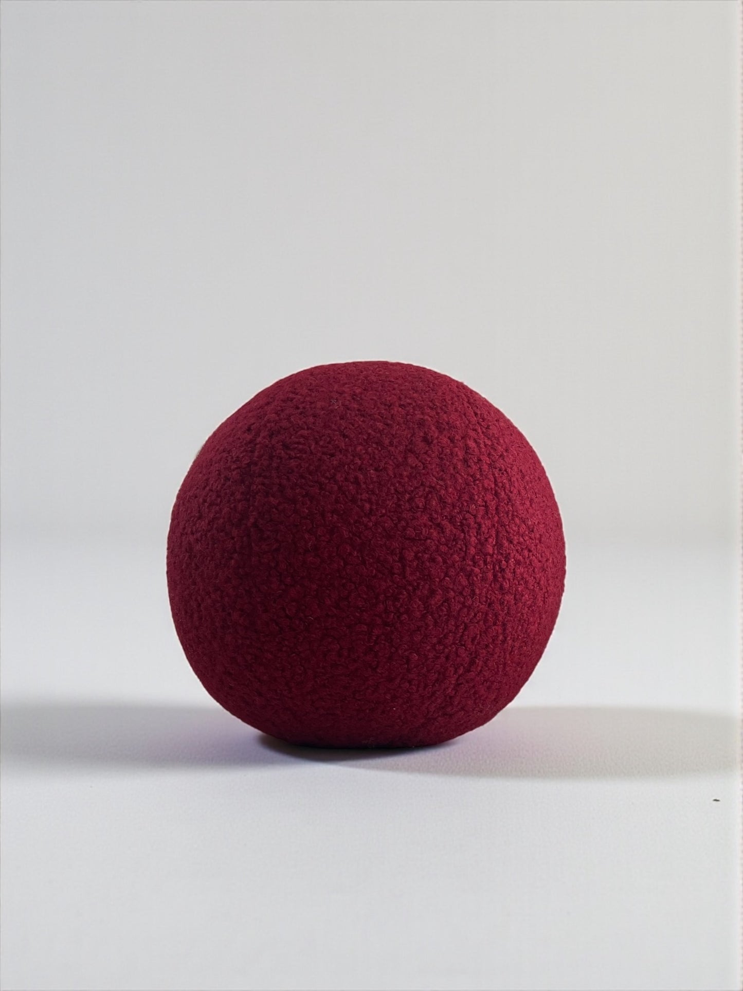 Burgundy Boucle Ball Pillow: Modern Minimalist Home Decor