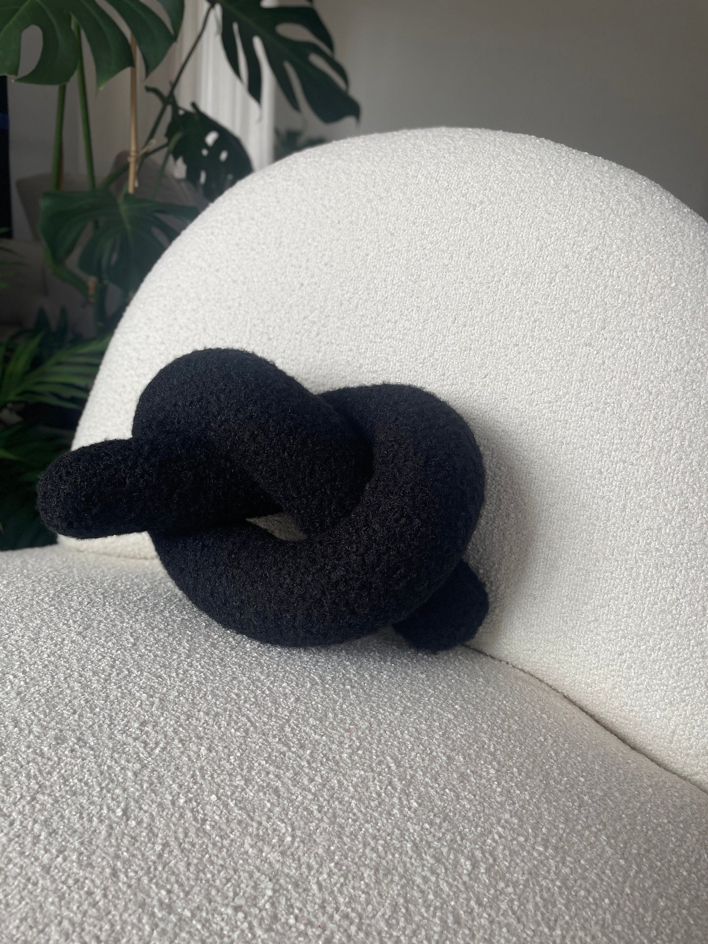 Black Boucle Knot Pillow: Modern Decorative Cushion