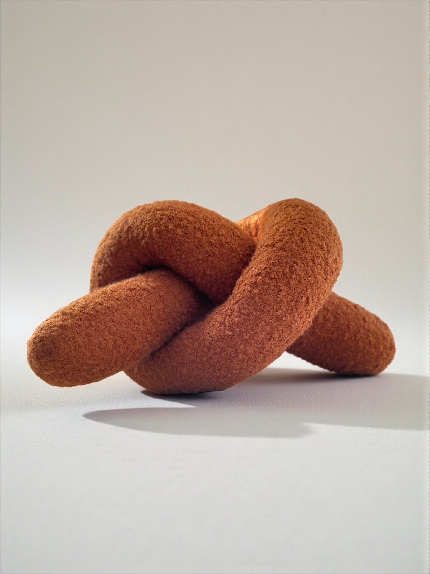 Boucle Knot Pillow: Terracotta Pretzel Plush Cushion