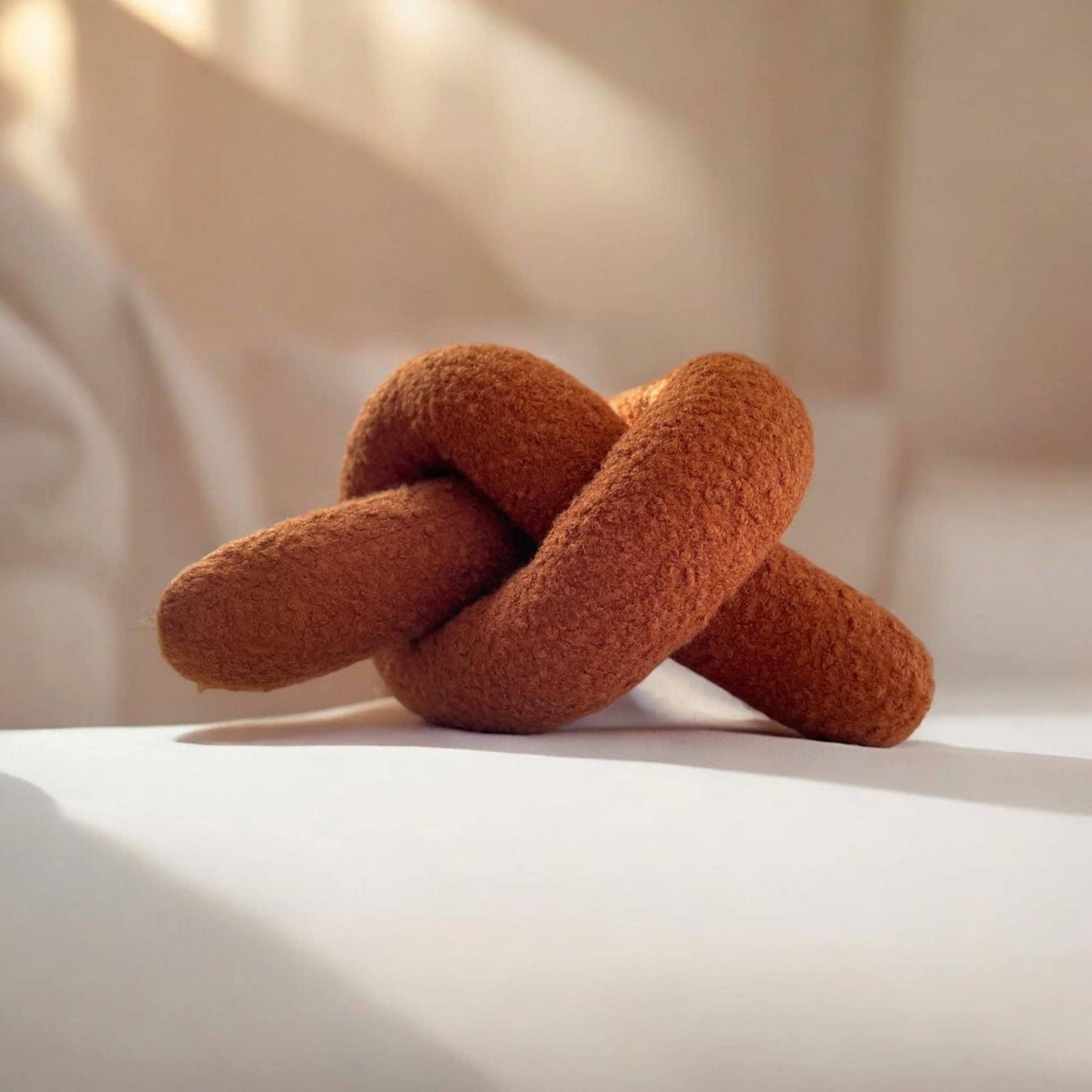 Boucle Knot Pillow: Terracotta Pretzel Plush Cushion