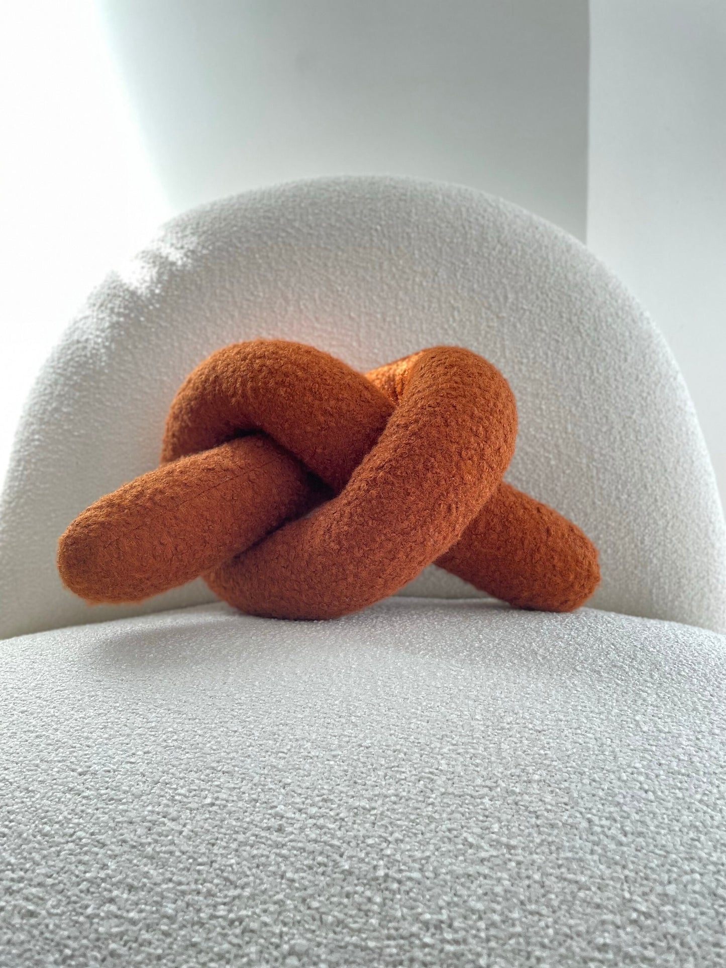 Boucle Knot Pillow: Terracotta Pretzel Plush Cushion