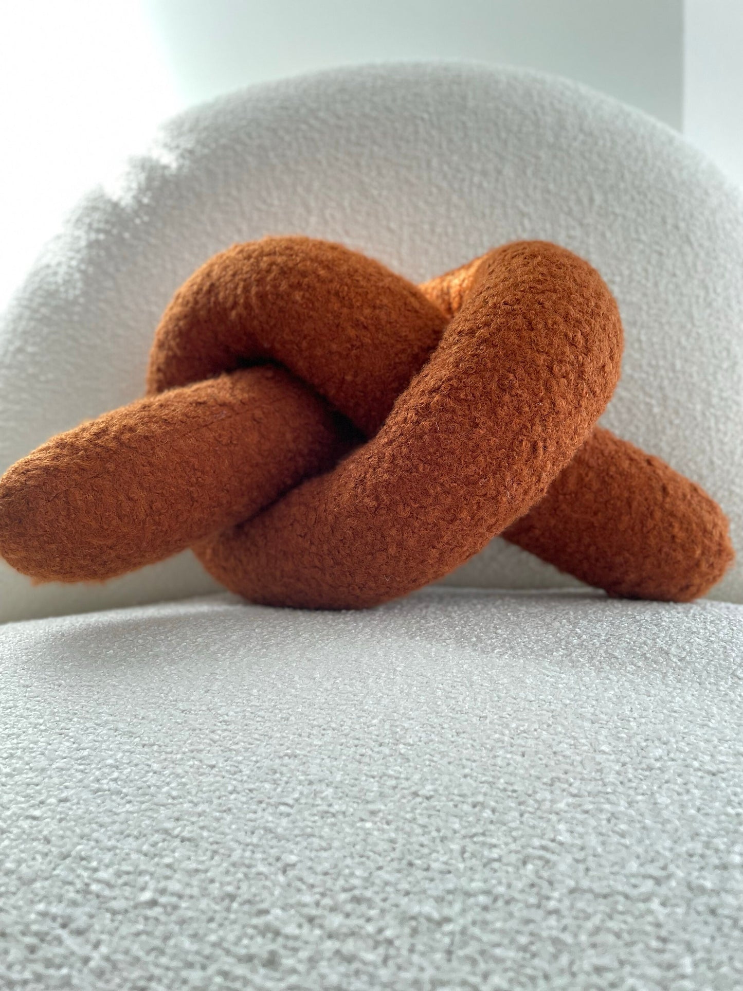 Boucle Knot Pillow: Terracotta Pretzel Plush Cushion