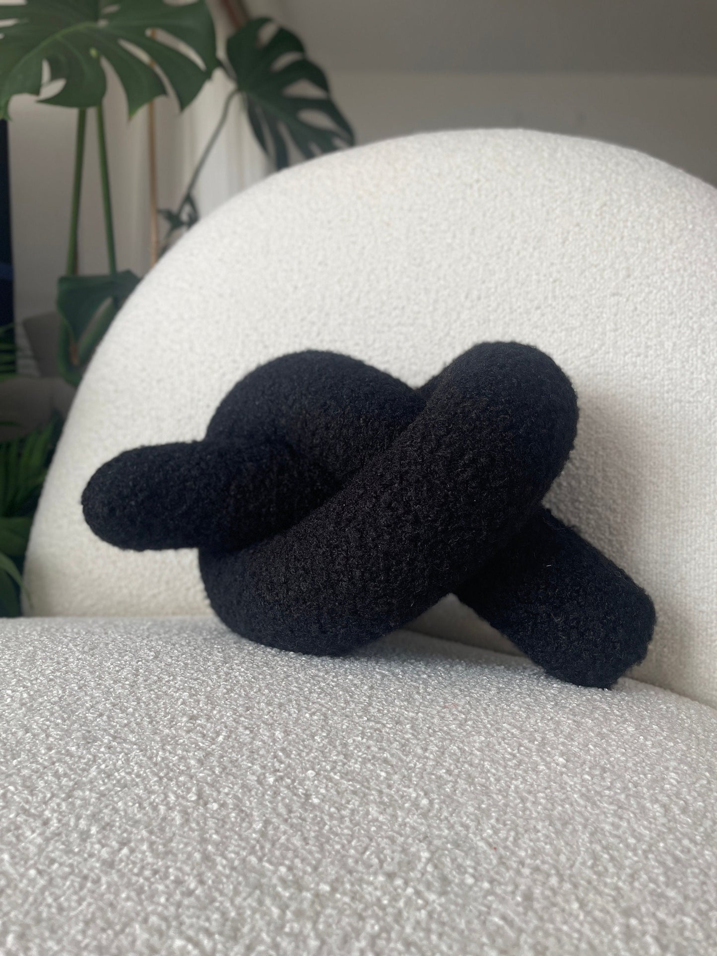 Black Boucle Knot Pillow: Modern Decorative Cushion