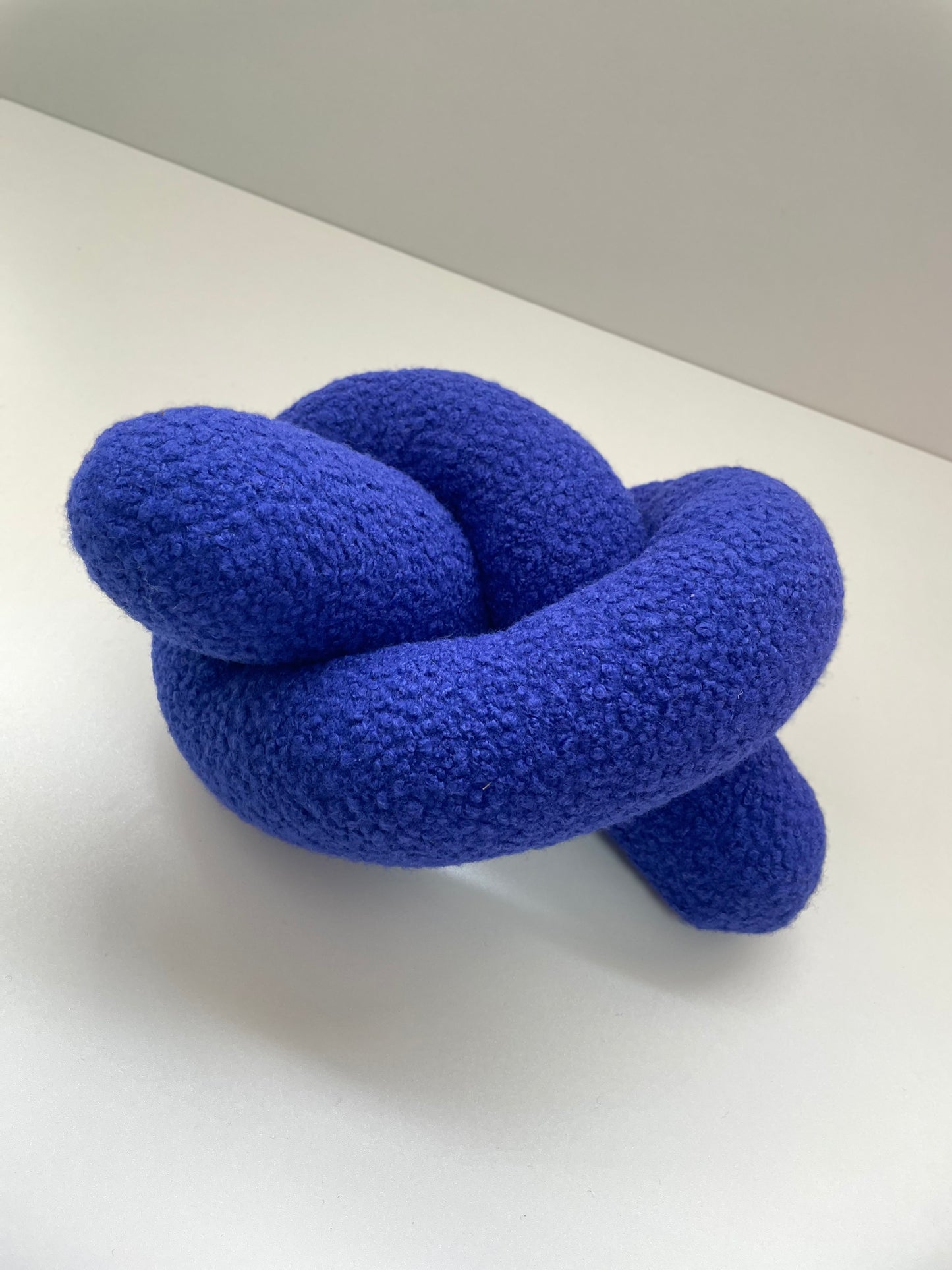 Blue Boucle Knot Pillow: Modern Accent Cushion
