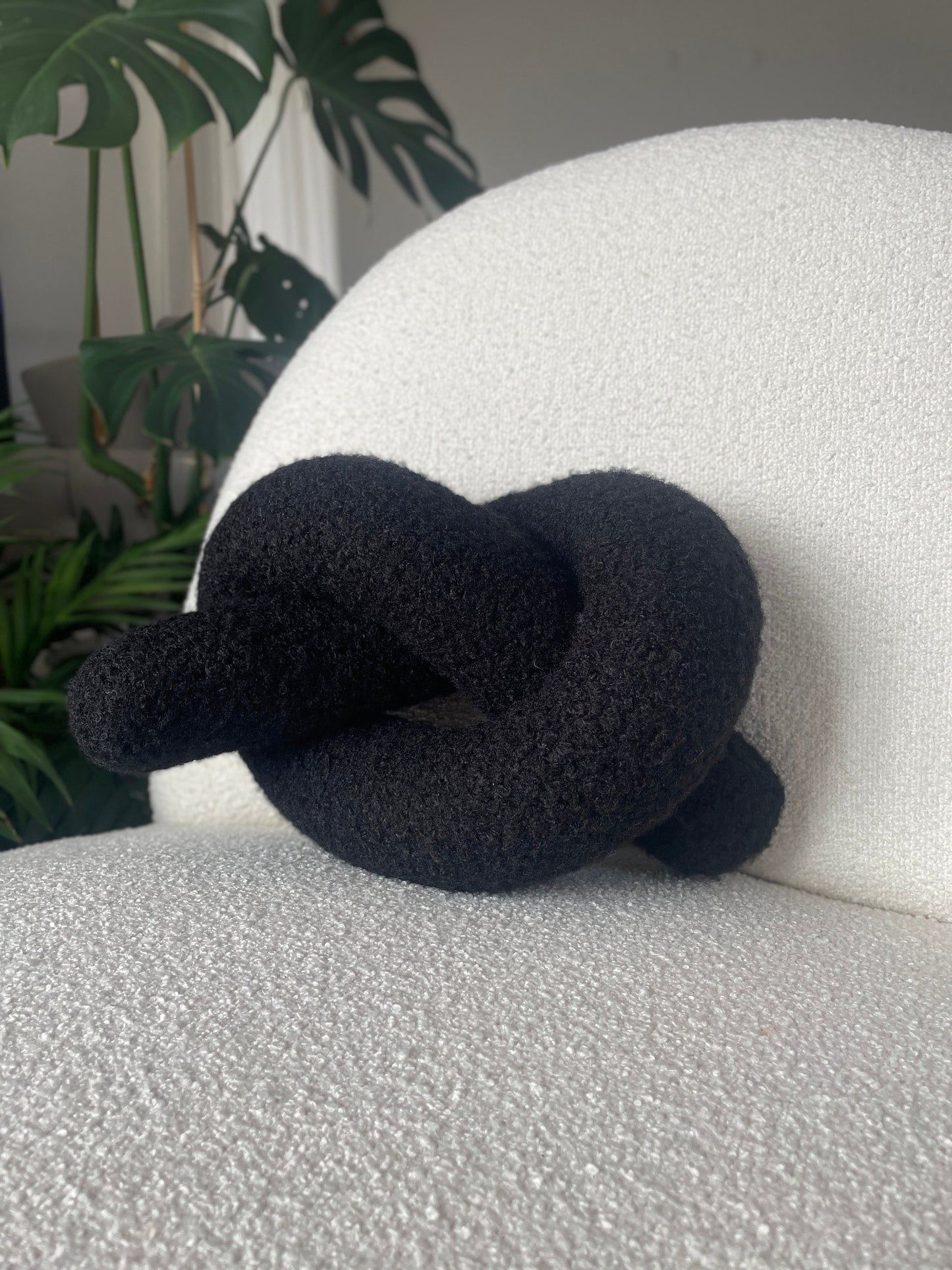 Black Boucle Knot Pillow: Modern Decorative Cushion