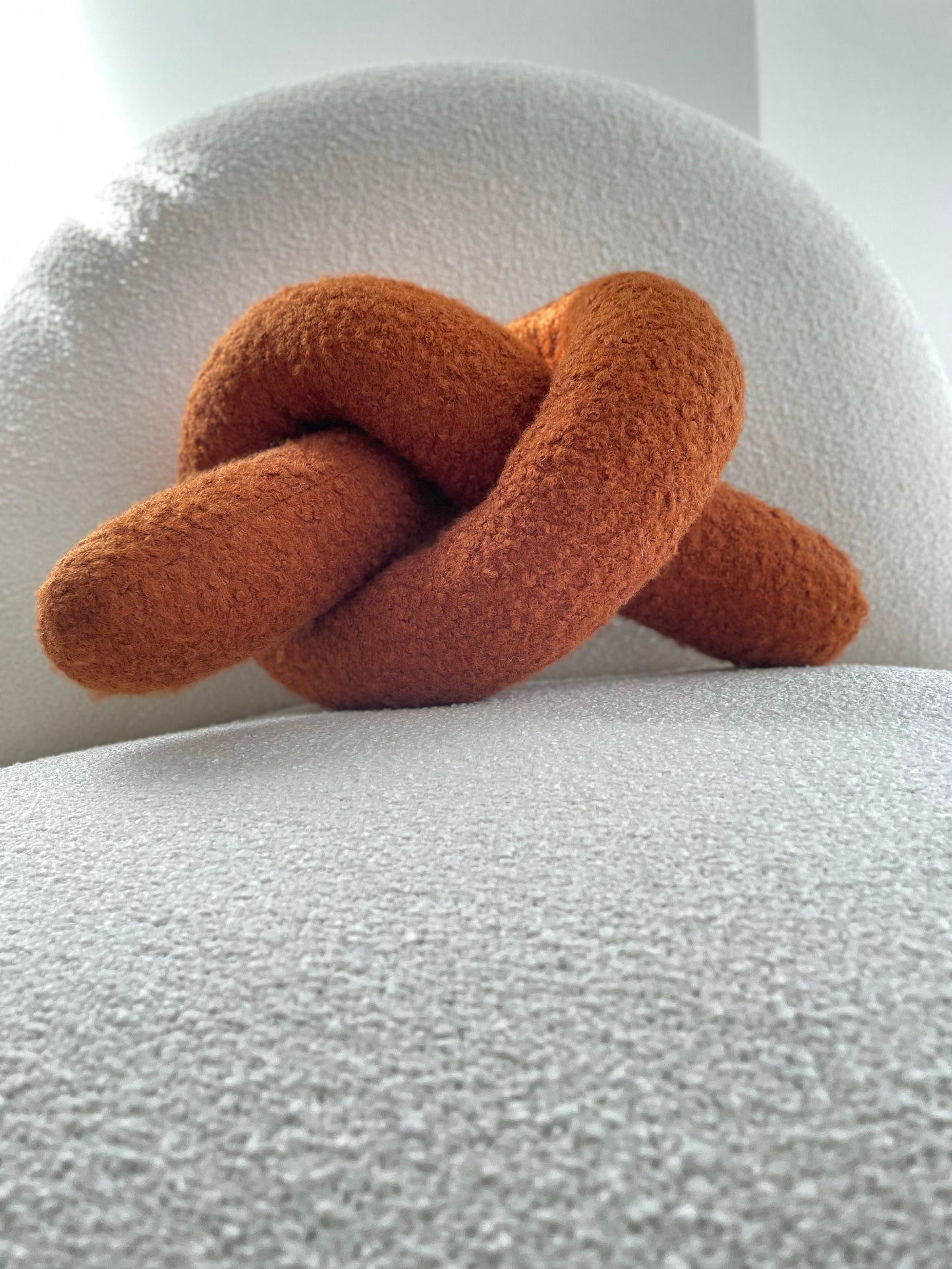 Boucle Knot Pillow: Terracotta Pretzel Plush Cushion